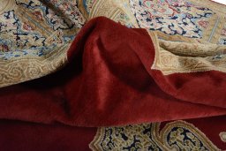 Surface texture of 2000s Kerman rug with natural Wool and intricate pattern
