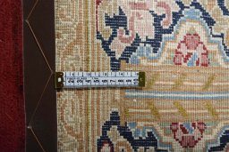 Backside of handmade 2000s Kerman rug showing knot structure and weave density