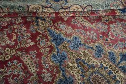 Surface texture of 1930s Kerman rug with natural Wool and intricate pattern