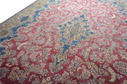 Backside of handmade 1930s Kerman rug showing knot structure and weave density
