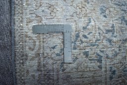 Backside of handmade 1970s Kerman rug showing knot structure and weave density
