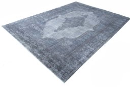 Corner detail of 1970s Kerman rug showing border pattern and Wool pile