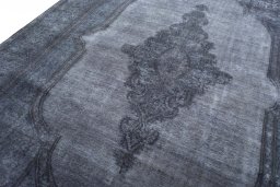 Backside of handmade 1970s Kerman rug showing knot structure and weave density