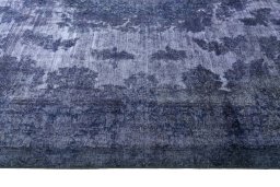 Corner detail of 1970s Kerman rug showing border pattern and Wool pile