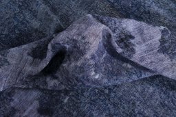 Surface texture of 1970s Kerman rug with natural Wool and intricate pattern