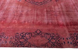 Corner detail of 1970s Kerman rug showing border pattern and Wool pile