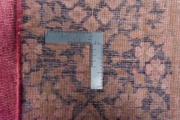 Backside of handmade 1970s Kerman rug showing knot structure and weave density