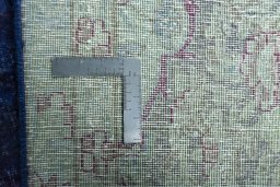 Backside of handmade 1970s Kerman rug showing knot structure and weave density
