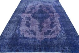 Surface texture of 1970s Kerman rug with natural Wool and intricate pattern