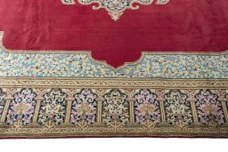 Corner detail of 2000s Kerman rug showing border pattern and Wool pile