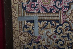 Backside of handmade 2000s Kerman rug showing knot structure and weave density