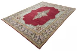 Corner detail of 2000s Kerman rug showing border pattern and Wool pile