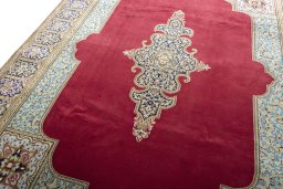 Backside of handmade 2000s Kerman rug showing knot structure and weave density