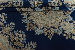 Close-up detail of 2000s Kerman rug from Iran / Persia showing Wool weave