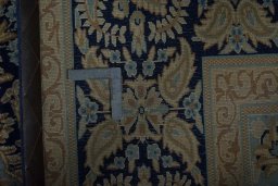Backside of handmade 2000s Kerman rug showing knot structure and weave density