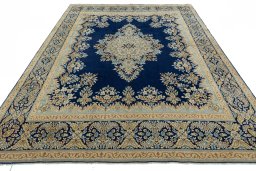 Surface texture of 2000s Kerman rug with natural Wool and intricate pattern