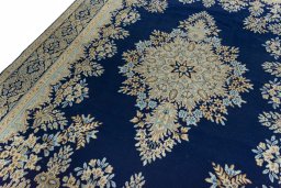 Backside of handmade 2000s Kerman rug showing knot structure and weave density