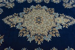 Central medallion detail of 2000s Kerman rug from Iran / Persia
