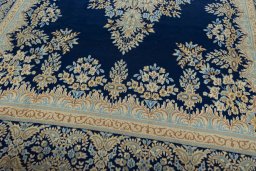 Close-up detail of 2000s Kerman rug from Iran / Persia showing Wool weave