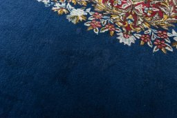 Close-up detail of 1970s Kerman rug from Iran / Persia showing Wool weave