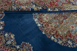 Surface texture of 1970s Kerman rug with natural Wool and intricate pattern