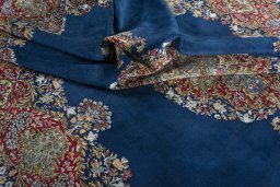Backside of handmade 1970s Kerman rug showing knot structure and weave density