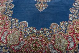 Close-up detail of 1970s Kerman rug from Iran / Persia showing Wool weave