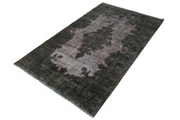 Corner detail of 1950s Kerman rug showing border pattern and Wool pile