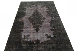 Surface texture of 1950s Kerman rug with natural Wool and intricate pattern