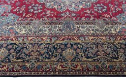 Corner detail of 1950s Kerman rug showing border pattern and Wool pile