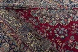 Close-up detail of 1950s Kerman rug from Iran / Persia showing Wool weave