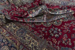 Surface texture of 1950s Kerman rug with natural Wool and intricate pattern