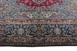 Full view of 1950s Kerman rug from Iran / Persia, 457 × 355 cm in Red tones