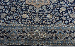 Close-up detail of 2000s Kerman rug from Iran / Persia showing Wool weave