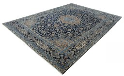 Corner detail of 2000s Kerman rug showing border pattern and Wool pile
