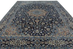 Surface texture of 2000s Kerman rug with natural Wool and intricate pattern
