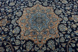 Central medallion detail of 2000s Kerman rug from Iran / Persia