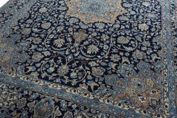 Close-up detail of 2000s Kerman rug from Iran / Persia showing Wool weave