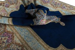 Surface texture of 1970s Kerman rug with natural Wool and intricate pattern