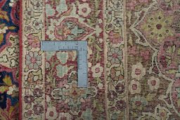 Surface texture of 1930s Kerman rug with natural Wool and intricate pattern