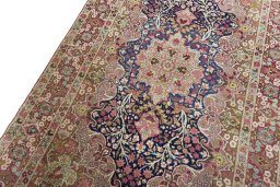 Backside of handmade 1930s Kerman rug showing knot structure and weave density