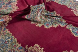 Surface texture of 1950s Kerman rug with natural Wool and intricate pattern