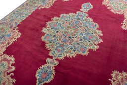 Backside of handmade 1950s Kerman rug showing knot structure and weave density