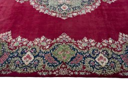 Corner detail of 1970s Kerman rug showing border pattern and Wool pile