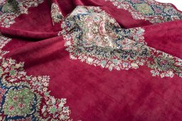 Surface texture of 1970s Kerman rug with natural Wool and intricate pattern