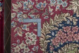 Backside of handmade 1970s Kerman rug showing knot structure and weave density