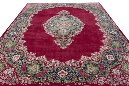 Surface texture of 1970s Kerman rug with natural Wool and intricate pattern