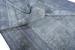Surface texture of 1970s Kerman rug with natural Wool and intricate pattern