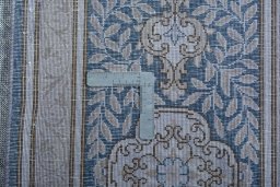 Backside of handmade 1970s Kerman rug showing knot structure and weave density
