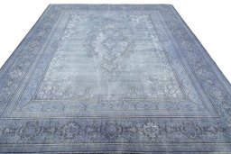 Surface texture of 1970s Kerman rug with natural Wool and intricate pattern